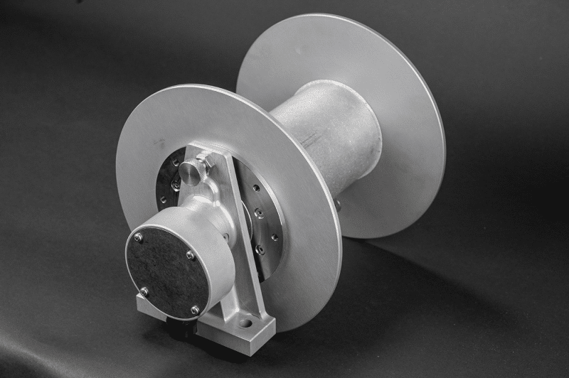 A 30amp reel featuring a sturdy metal shaft and a protective metal cover, designed for durability and efficiency