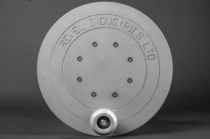 A metal plate featuring a central hole and a bottom hole, designed for a 30amp reel application