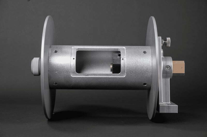 A metal cable reel with a protected cover and strong shaft for effective cable management and storage