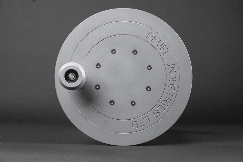 A gray metal disc with a central hole, resembling an air reel component, showcasing its industrial design