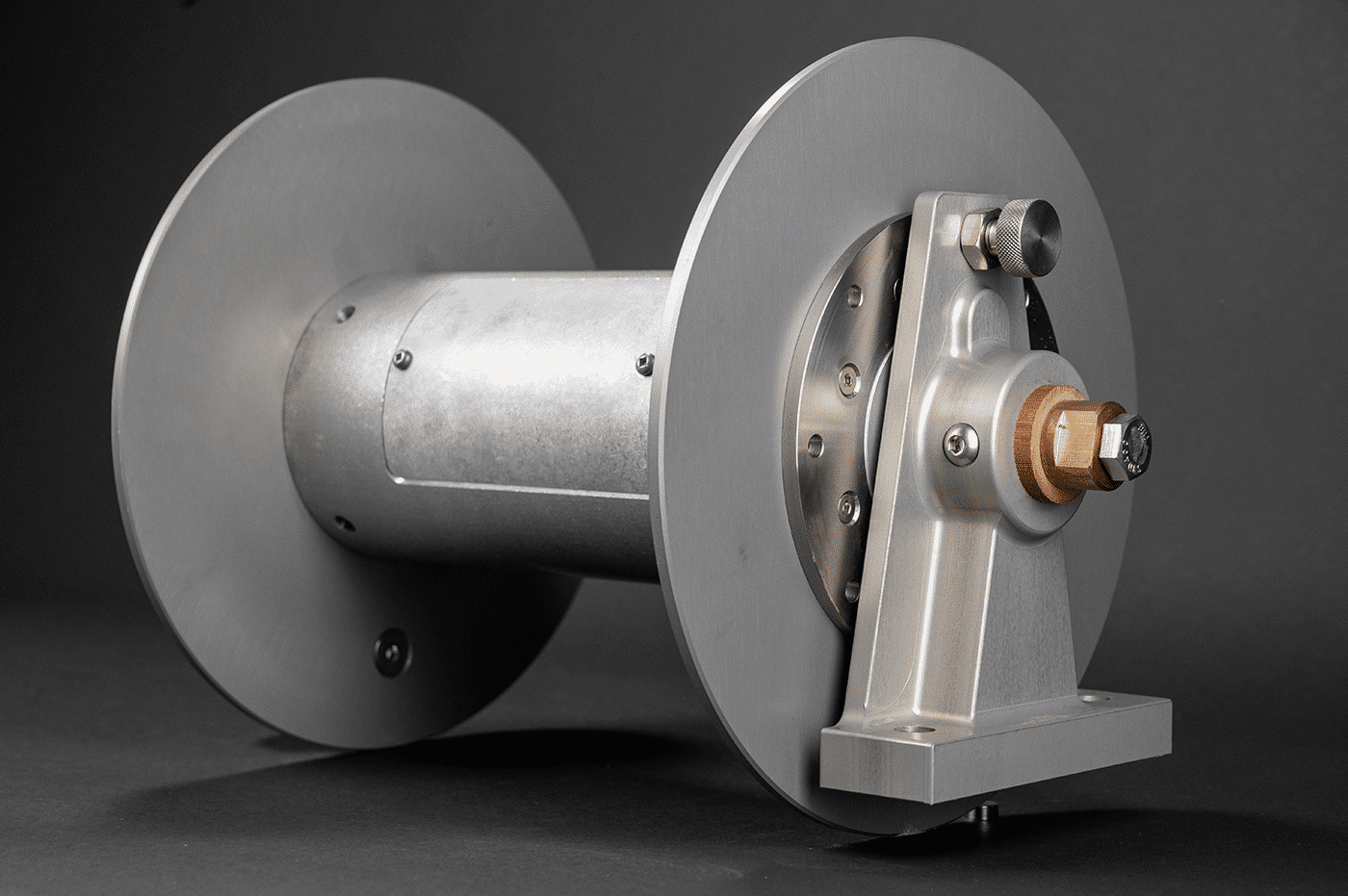 A metal cable reel featuring a strong shaft and protective cover, designed for efficient cable storage and management