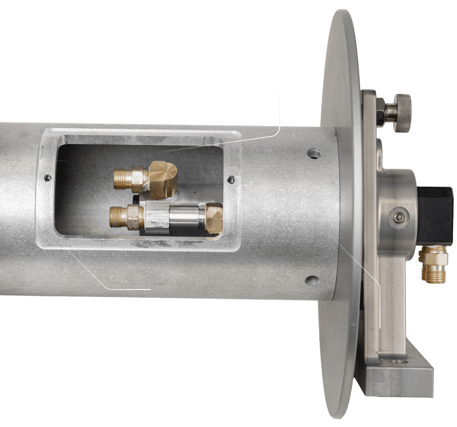 A close-up view of a metal pipe featuring a valve, showcasing the craftsmanship of Reel by Revel Industries